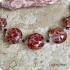 Lentil roze-rood (lampwork)