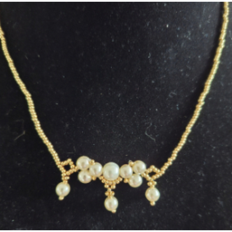 Ketting zilver met goudkleurige miyuki kralen met creme witte glasparels