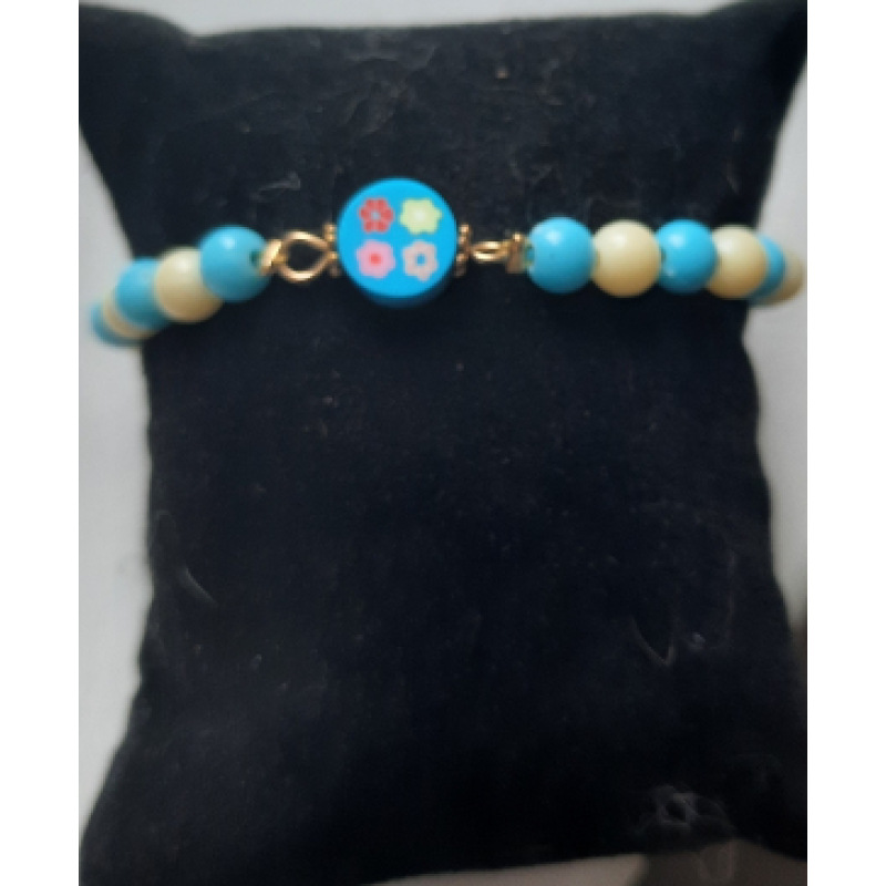 Kinderarmband met kralen 16cm blauw/wit met bloem polymeerkraal