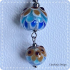 Bruin blauwe lotushanger van glas met ketting (lampwork)