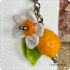 Citroen met bloem en blad oorbel van glas (lampwork)