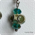 Turquoise stip donut bead oorbel van glas (lampwork)