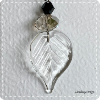 Blad oorbel helder met zwart (lampwork)